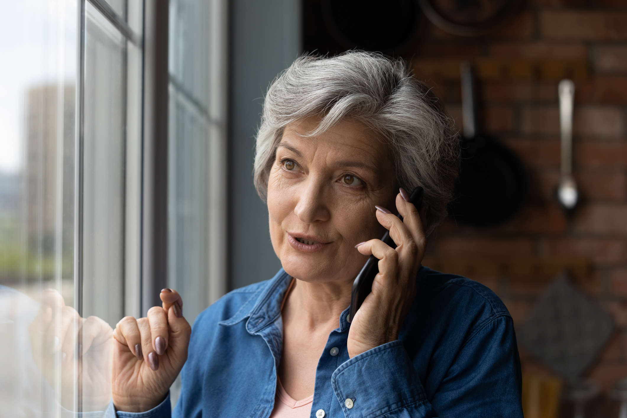 Woman on the phone to home insurance company