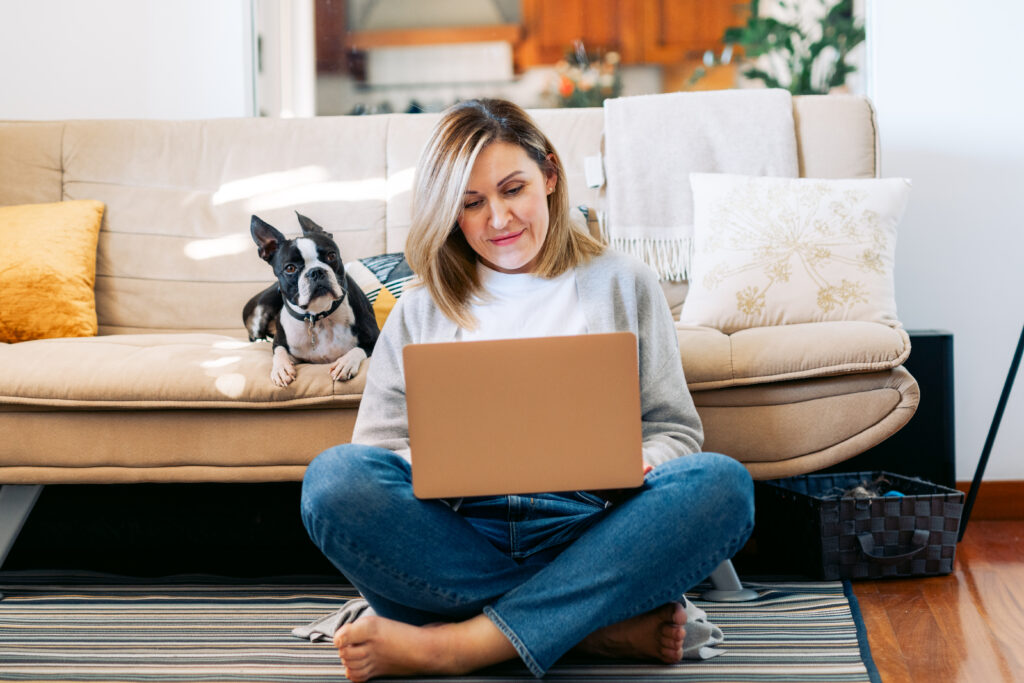 woman looking at her finances on her laptop